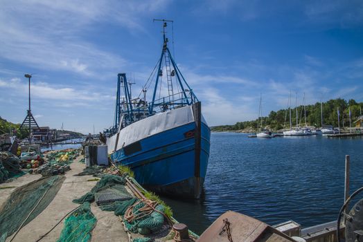 The fishing boats is moored to the docks in Grebbestad, Sweden.