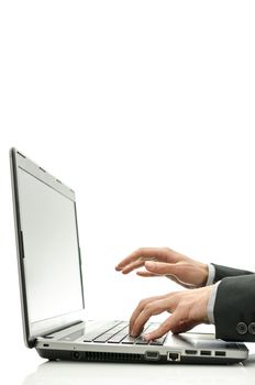 Detail of student hands working on laptop.