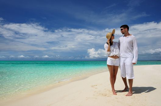 Couple on a tropical beach at Maldives