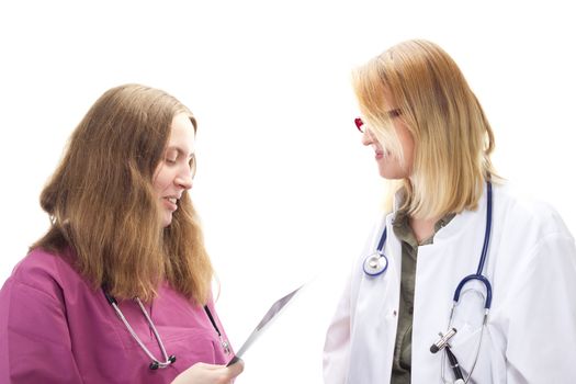 Two female doctors discussing about a patients health problems