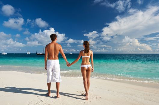 Couple on a tropical beach at Maldives