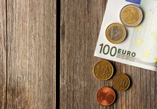 Euro currency over wooden background