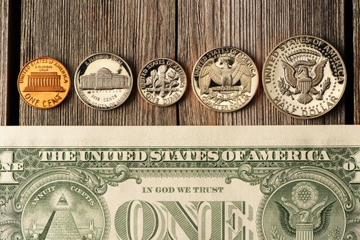 New uncirculated US money over wooden background