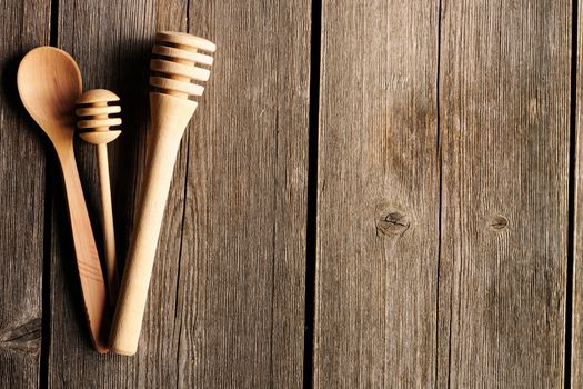 Wooden spoon and dippers on table
