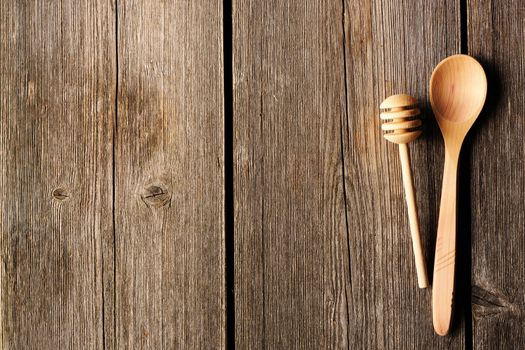 Wooden spoon and dipper on table