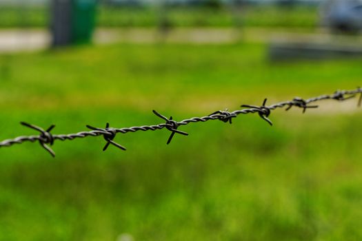 barbed wire defending the industries