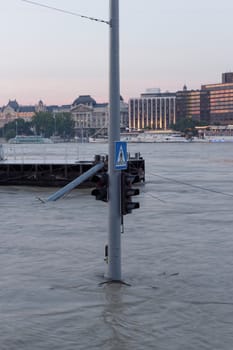 traffic light on flooding river