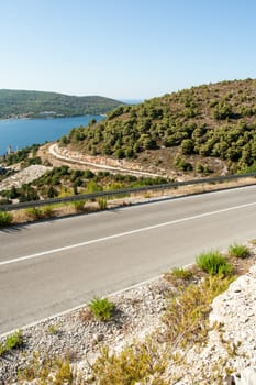 winding road in deserted landscape in vis island