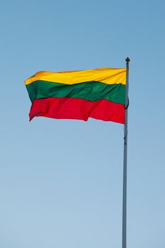 Lithuanian flag against blue sky