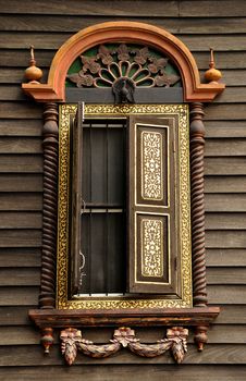 Window of the house is decorated with exquisite antiques.