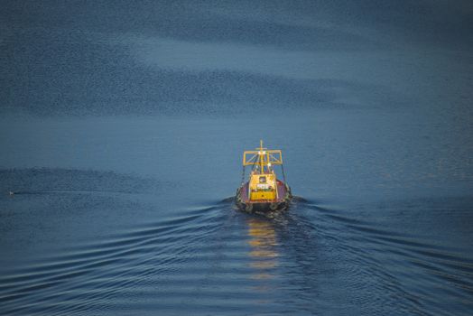 The boat check the water-depth in Ringdalsfjord in Halden, Norway to see if Mv North Sea Giant can be towed out to the open sea.