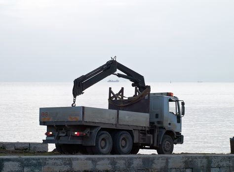 Ship on sea trial in cloudy afternoon - the truck is going back