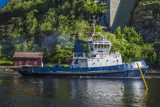 Tug Achilles and tug Belos have started towing the MV North Sea Giant through Ringdalsfjord in Halden, Norway.