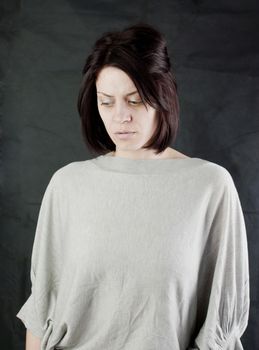 conceptual portrait of stressed abused young woman 