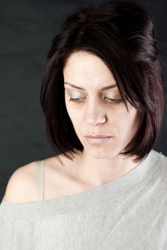 conceptual portrait of stressed abused young woman 