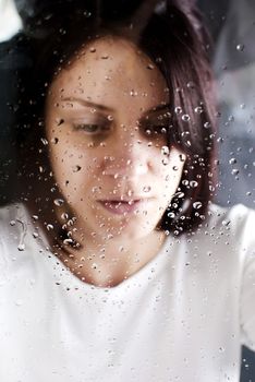 conceptual portrait of stressed abused young woman 