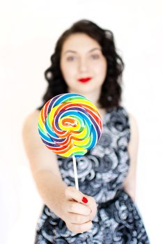 beautiful retro girls portrait with colorful lollipop