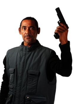 An aggressive looking man wields a gun in his left hand.