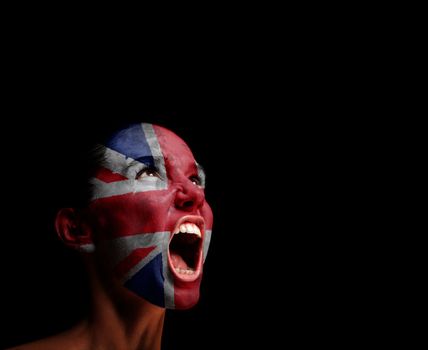 The British flag on the face of a screaming woman. concept