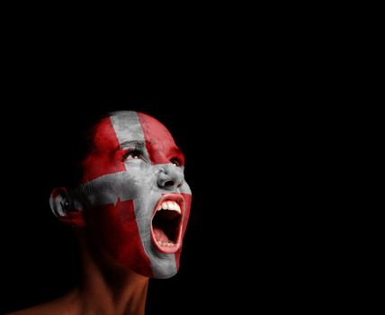 The Danish flag on the face of a screaming woman. concept