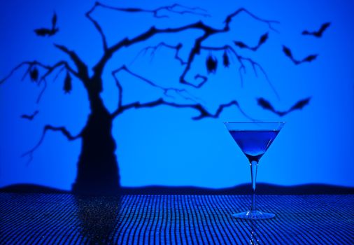 Cobalt Martini in Halloween setting with bats and a tree