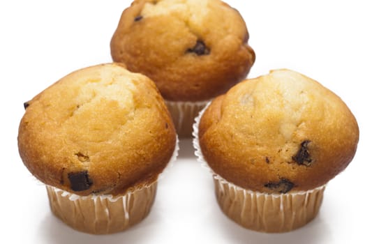 sweet muffins with chocolate drops isolated on a white background