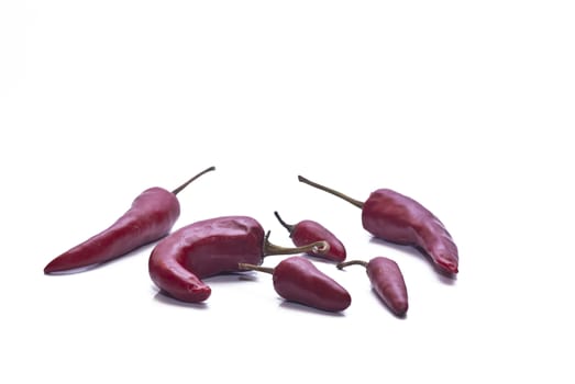 Fresh red hot chili peppers isolated on white background