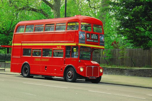 Red route 9 bus with passengers in London