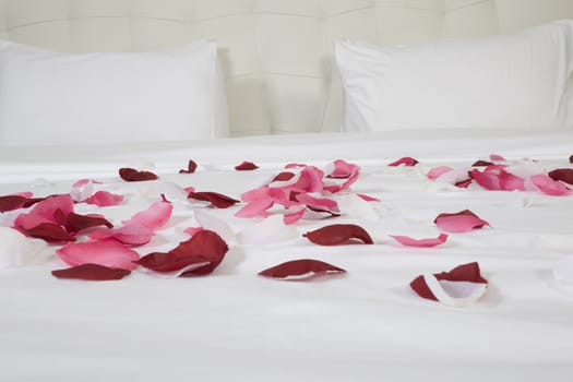 hotel room with big bed and red flowers