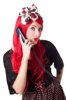 Chocked retro woman with red hair on the phone isolated on white