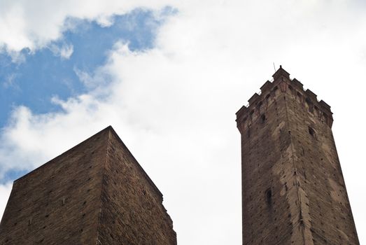Due Torri - symbol of city under cloudy sky in Bologna, Italy