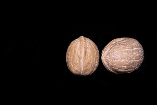 fresh walnuts isolated on a black background