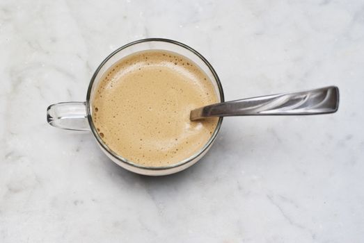 cup of italian coffee isolated on white marble background