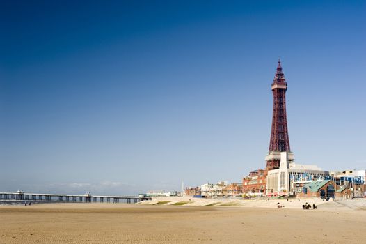 View of the beachfront at Blackpool along the golden sands to the pier and Blackpool Tower