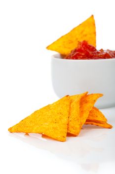 Nachos corn chips with fresh salsa isolated on white