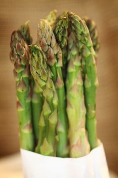 close up of fresh green asparagus bunchq shallow dof