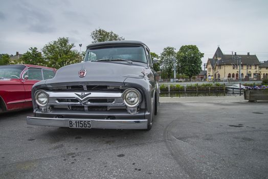 The image is shot at a fish-market in Halden, Norway where there every Wednesday during the summer months are held classic American car show.