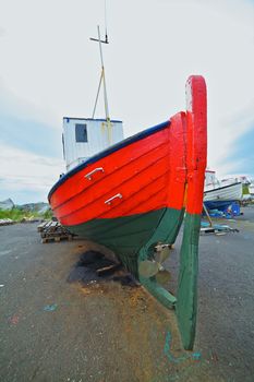 Fishing boats repair in the harbor of Husavik, Iceland