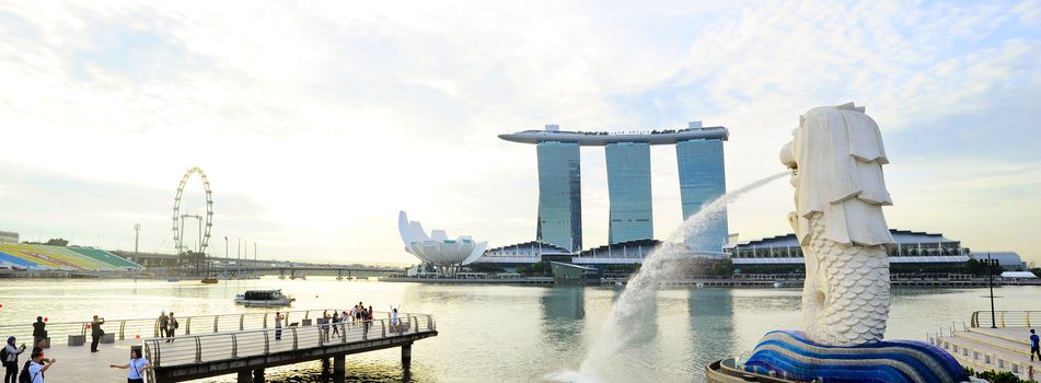 Singapore, Republic of Singapore - May 09, 2013  The Merlion fountain in front of the Marina Bay Sands hotel in Singapore. Merlion is a imaginary creature with the head of a lion, seen as a symbol of Singapore