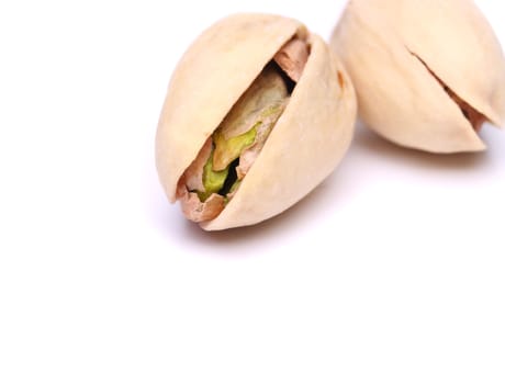 Pistachio nuts, fruits isolated on the white background
