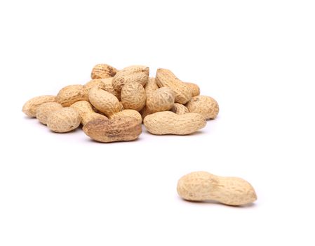 A peanut and a hill of peanuts on the white backgroun.