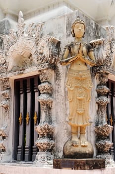 Buddha sculptures in an ancient buddhist wat in Thailand