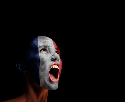 The French flag on the face of a screaming woman. concept