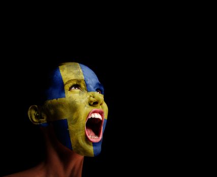 The Swedish flag on the face of a screaming woman. concept