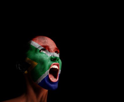 The Republic of South Africa flag on the face of a screaming woman. concept