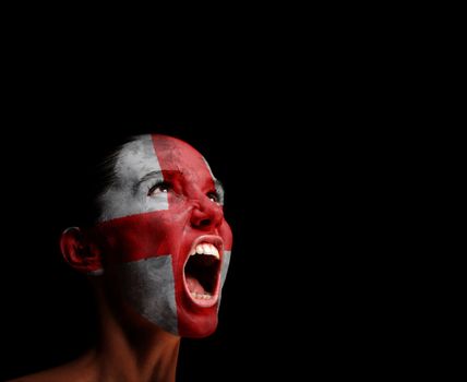 The England flag on the face of a screaming woman. concept