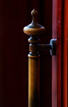 Old brass door handle on wood door