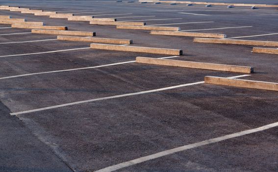 Empty parking lots with concrete car stop