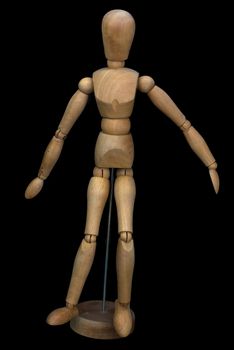 Wooden pose puppet (manikin) on stand with black background