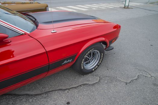 The image is shot at a fish-market in Halden, Norway where there every Wednesday during the summer months are held classic American car show.